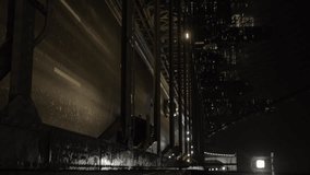 Vertical video of cars passing on the Brooklyn Bridge in New York, USA, filmed on a dark, cold, and foggy night, with the city's skyscrapers in the background. - Powered by Shutterstock - Get 15% off with code: PIKWIZARD15