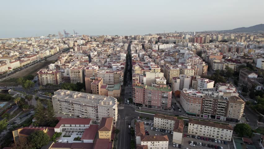 An Aerial View presents a cityscape of dense buildings and streets in an urban setting, Malaga, Andalucia, Spain
