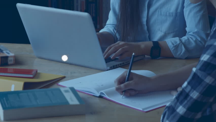 Animation of global network and data over midsection of diverse students writing and using laptop. Connection, digital interface, education, learning and communication, digitally generated video.