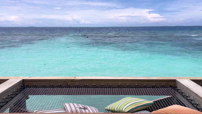 Serene Turquoise Waters and Horizon of the Maldives: A Peaceful Escape