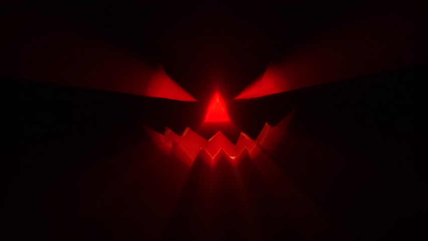 Jack-o-lantern - Halloween pumpkin with candle against a dark background with light rays, in a spooky Halloween concept, 4k