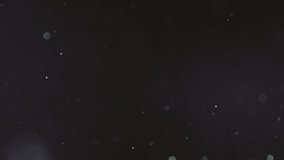 Beautiful shiny dust particles fly abstract black bokeh background. Glitter floating air. Magic glow sequins close up. Iridescent sparkles shimmer. Blurry spangles waving. Holiday Christmas decoration - Powered by Shutterstock - Get 15% off with code: PIKWIZARD15