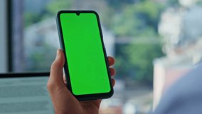 Businessman finger tapping on chroma key cellphone browsing message at modern workplace closeup. Unknown businessman touching green screen touchscreen mobile phone. Freelancer shopping online indoors. - Powered by Shutterstock - Get 15% off with code: PIKWIZARD15