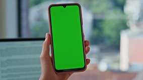 Lady hand tapping chroma key smartphone in company office closeup. Unknown woman turning on online application om green screen cellphone. Businesswoman browsing social media at mockup mobile phone. - Powered by Shutterstock - Get 15% off with code: PIKWIZARD15