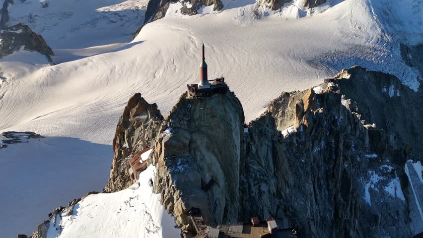 The Aiguille du Midi summit at sunrise, aerial view (The Alps, France)