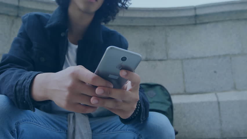 Animation of network of connections and globe over biracial man using smartphone. Global connections, computing and data processing concept digitally generated video. - Powered by Shutterstock - Get 15% off with code: PIKWIZARD15