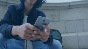 Animation of network of connections and globe over biracial man using smartphone. Global connections, computing and data processing concept digitally generated video. - Powered by Shutterstock - Get 15% off with code: PIKWIZARD15