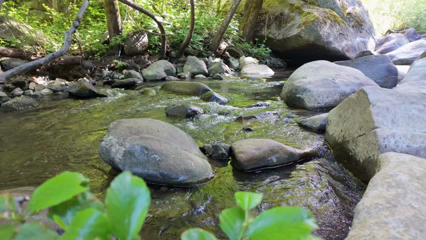 Deer creek near nevada city with water flowing over large rocks 