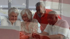 Animation of flag of usa over diverse senior people using laptop. Retirement and patriotism concept digitally generated video. - Powered by Shutterstock - Get 15% off with code: PIKWIZARD15