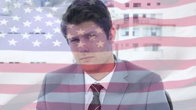 Animation of flag of usa over caucasian businessman smiling. Global business and patriotism concept digitally generated video. - Powered by Shutterstock - Get 15% off with code: PIKWIZARD15