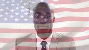 Animation of flag of usa over african american businessman. Global business and patriotism concept digitally generated video. - Powered by Shutterstock - Get 15% off with code: PIKWIZARD15