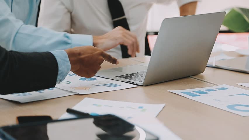 Business Financial Analysts Reviewing Financial Reports on Digital Devices, Collaborating in Corporate Meetings to Plan Investment Projects, and Highlighting the Success of Their Team Efforts