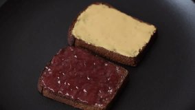Sandwiches with toast bread, peanut butter and raspberry or strawberry jam. Hearty, nutritious breakfast - Powered by Shutterstock - Get 15% off with code: PIKWIZARD15