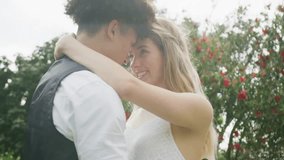 Animation of cloud house over happy diverse couple embracing in garden on wedding day. Couple, marriage, nature, summer, celebration, future, togetherness, love and romance, digitally generated video. - Powered by Shutterstock - Get 15% off with code: PIKWIZARD15