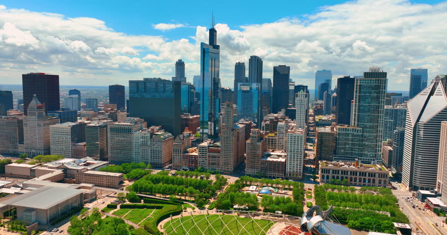 Scenery of beautiful Millennium Park at the lakefront of Chicago. Stunning view of green zone in combination with modern architecture. Aerial view. Sunny summer day.