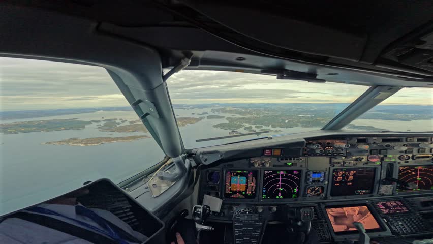 Cockpit pilot captain forward view of airplane landing at runway Bergen Norway airport