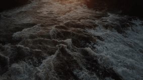 Storforsen waterfall at sunset, glowing with vibrant golden light, cascading waters, and mist rising into the tranquil evening sky. Captivating view of Sweden’s natural beauty, perfect for nature phot - Powered by Shutterstock - Get 15% off with code: PIKWIZARD15