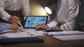 Business people working together using a digital tablet and analyzing financial report on paper - Powered by Shutterstock - Get 15% off with code: PIKWIZARD15