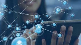 Animation of network of connections with people icons over biracial woman using tablet. Global connections, computing and data processing concept digitally generated video. - Powered by Shutterstock - Get 15% off with code: PIKWIZARD15