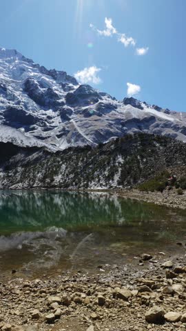 Vertical HD video panoramic view of Humantay lake on Salcantay mountain in the Andes. Lagoon in Peru.