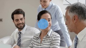 Animation of network of connections with icons over caucasian colleagues using laptop in office. Global business, teamwork and digital interface concept digitally generated video. - Powered by Shutterstock - Get 15% off with code: PIKWIZARD15