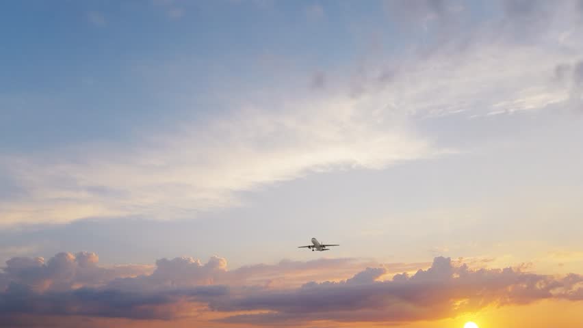 3840x2160 ULTRA HD. Airplane flies in blue sky. Travel. Airplane takes off against the background of blue Sky. 4K.