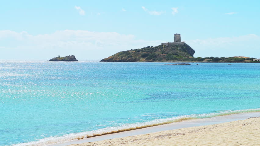 Torre watchtower of Coltellazzo Saint Efisio in Nora archeological site of Sardinia, Italy with view on Mediterranean sea