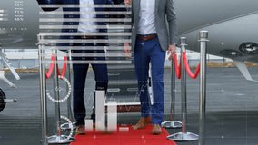 Animation of financial data processing over caucasian businessmen by airplane. Global travel, finance, business, connections, computing and data processing concept digitally generated video. - Powered by Shutterstock - Get 15% off with code: PIKWIZARD15