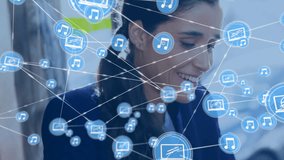 Animation of network of connections with music icons over biracial woman with tablet. Global finance, business, connections, computing and data processing concept digitally generated video. - Powered by Shutterstock - Get 15% off with code: PIKWIZARD15