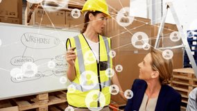 Animation of network of people icons over caucasian workers in meeting at warehouse. Industry, teamwork, connection, data and communication, digitally generated video. - Powered by Shutterstock - Get 15% off with code: PIKWIZARD15