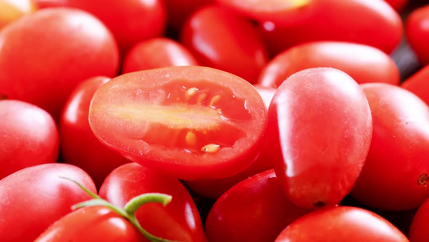 fresh tomatoes on wooden background