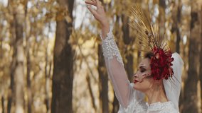 Woman in an ornate costume with face paint and a floral headdress, posing in a forest. Fantasy portrait photography with creative makeup - Powered by Shutterstock - Get 15% off with code: PIKWIZARD15
