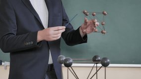 Male Scientist, Teacher Shows Model Of Molecular Structure In Lab - Powered by Shutterstock - Get 15% off with code: PIKWIZARD15