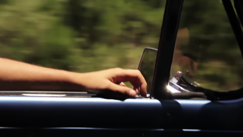 Close-Up of a Hand Driving an Old Pickup Truck