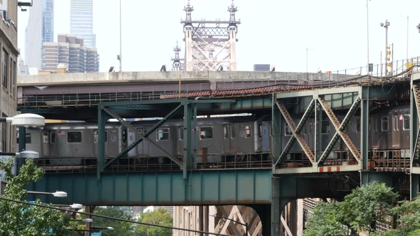 New York elevated subway, metropolitan bridge, metro track above street. Railway transport, vintage Queensboro station railroad line. Queens public train transportation. Long Island city United States