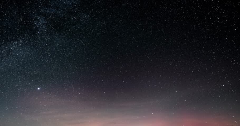 Dark starry night sky with stars and red aurora borealis in Astronomy background Time lapse