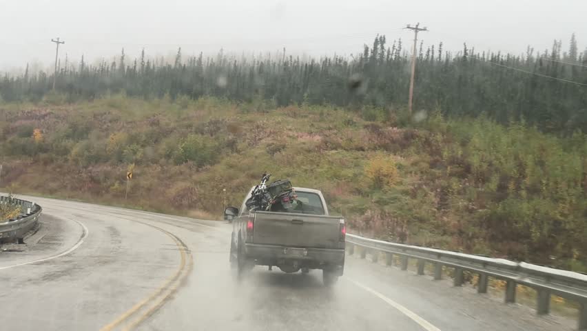 driving the Dalton Highway under cloudy sky