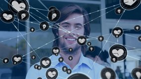 Animation of network of connections with heart icons over caucasian man in cafe. Global business, connections, computing and data processing concept digitally generated video. - Powered by Shutterstock - Get 15% off with code: PIKWIZARD15