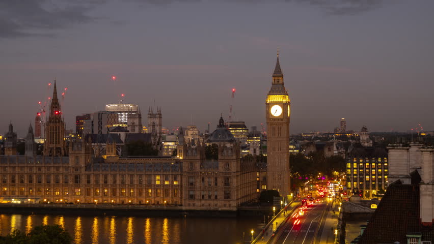 timelapse of the iconic big ben clock in london, england during sunrise