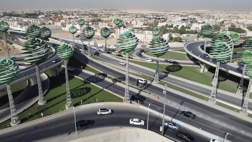 Drone view of busy motorway The Green Field Riyadh KSA video , Aerial view of road interchange or highway intersection with busy urban traffic . Junction network of transportation