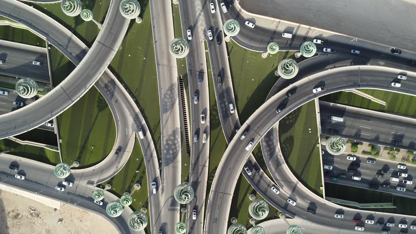 Drone view of busy motorway The Green Field Riyadh KSA video , Aerial view of road interchange or highway intersection with busy urban traffic . Junction network of transportation