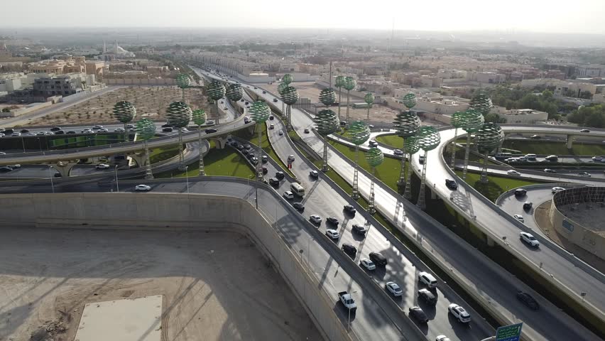 Drone view of busy motorway The Green Field Riyadh KSA video , Aerial view of road interchange or highway intersection with busy urban traffic . Junction network of transportation