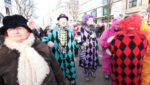 DUSSELDORF, GERMANY – FEBRUARY 10: People present their costumes for the next day celebration of Rosenmontag Karneval or Carnival. February 10, 2013,  Düsseldorf, Germany
