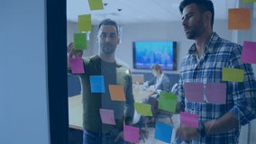 Animation of network of connections with icons over diverse colleagues brainstorming in office. Global business, connections and digital interface concept digitally generated video. - Powered by Shutterstock - Get 15% off with code: PIKWIZARD15