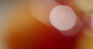A soft focus abstract bokeh background featuring warm hues of red, pink, and yellow. Ideal for designs conveying warmth, light, and sophistication. Abstract Bokeh Background - Powered by Shutterstock - Get 15% off with code: PIKWIZARD15