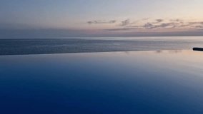 Beautiful Ocean View Infinity Swimming Pool Luxury Resort Hotel Vacation Travel Relax Nobody. Sunrise Sky and Cirrus Clouds Pool Beach, Swimming Pool with Sea View. - Powered by Shutterstock - Get 15% off with code: PIKWIZARD15