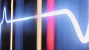 This image shows a closeup of an EKG waveform on a medical monitor, highlighting vital signs and health - Powered by Shutterstock - Get 15% off with code: PIKWIZARD15