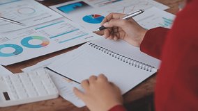 Business Financial Analysts Utilizing Digital Devices to Review Financial Reports, Collaborating on Investment Projects During Corporate Meetings and Celebrating the Success of Their Strategic Team - Powered by Shutterstock - Get 15% off with code: PIKWIZARD15