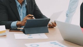 Corporate Financial Analysts Using Digital Devices to Analyze Business Financial Reports, Strategizing Investment Projects During Meetings, and Highlighting the Success of Their Team Strategic Plan - Powered by Shutterstock - Get 15% off with code: PIKWIZARD15