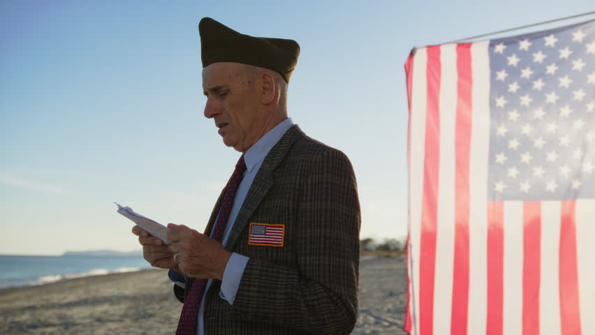 Vietnam War Veteran Reads Speech For The Fallen On The Beach Near The Ocean